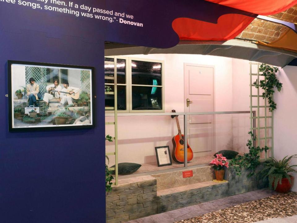 A reconstruction of John Lennon’s No.9 bungalow with Donovan’s guitar outside at the 'Beatles in India' exhibition