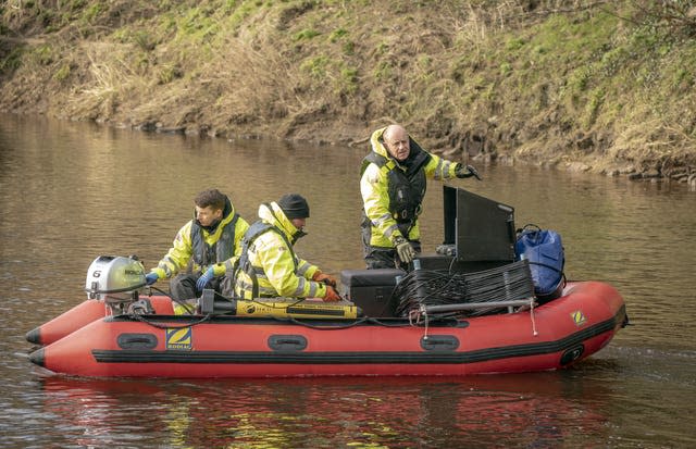 Workers from Specialist Group International on the River Wyre, near St Michael&#x002019;s on Wyre, Lancashire, on Monday 