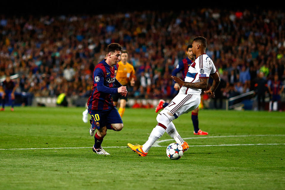 Lionel Messi of Barcelona passes by Jerome Boateng of Bayern to score his second goal during the first leg of UEFA Champions League semifinal match between FC Barcelona and FC Bayern Muenchen at Camp Nou on May 6, 2015 in Barcelona, Spain.