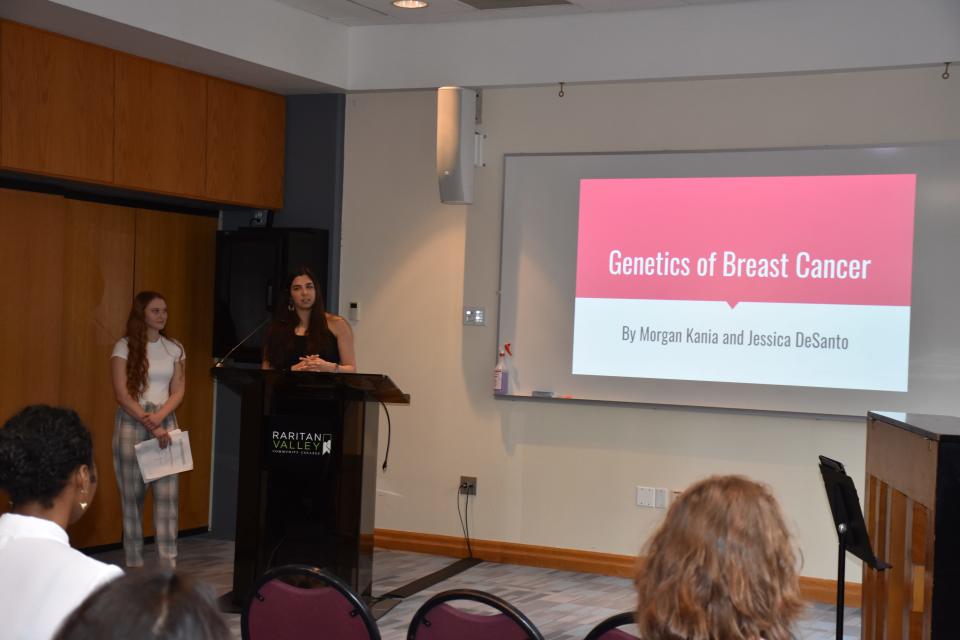 RVCC Honors College students Morgan Kania, (left), and Jessica DeSanto present their Capstone Course project on “Genetics of Breast Cancer.”