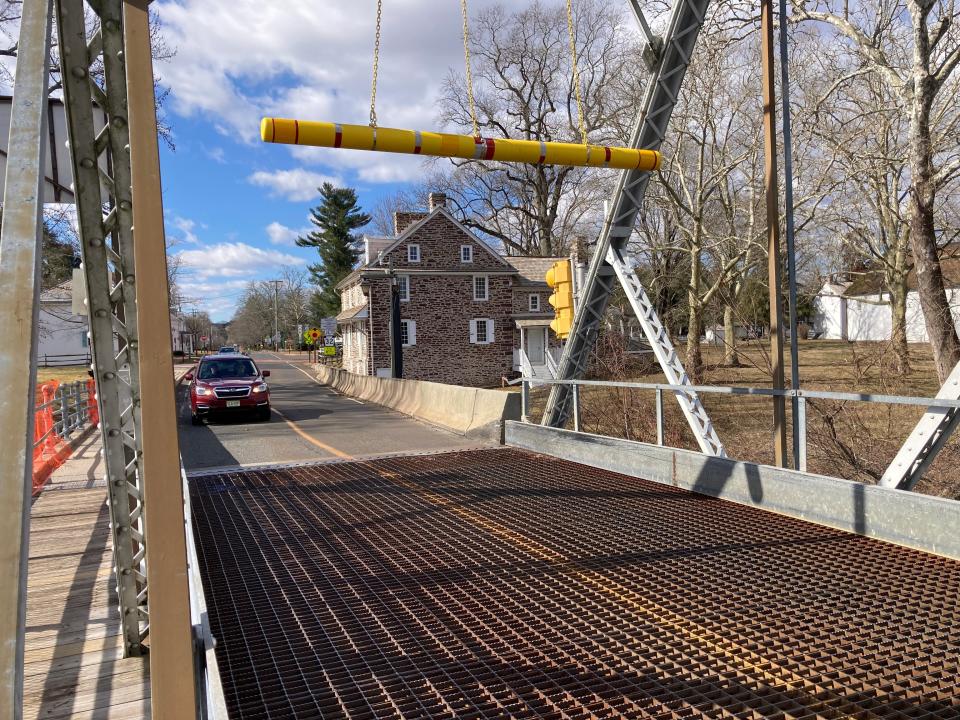 A car approached the Washington Crossing bridge in Upper Makefield, Pa. The Delaware River Joint Toll Bridge Commission may replace the 1905 span citing age, wear and narrow travel lanes that cause jams, fender-benders and regularly damage motorists’ side-view mirrors.