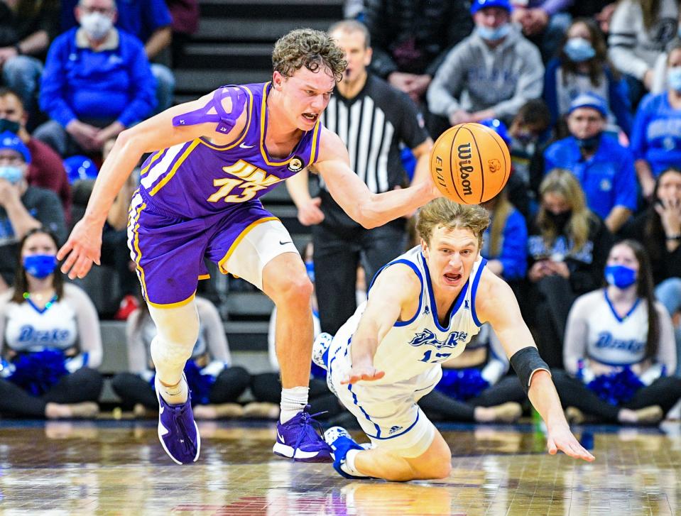 Northern Iowa guard Bowen Born, left, battles for a ball against Drake guard Tucker DeVries on Feb. 5 in Des Moines.