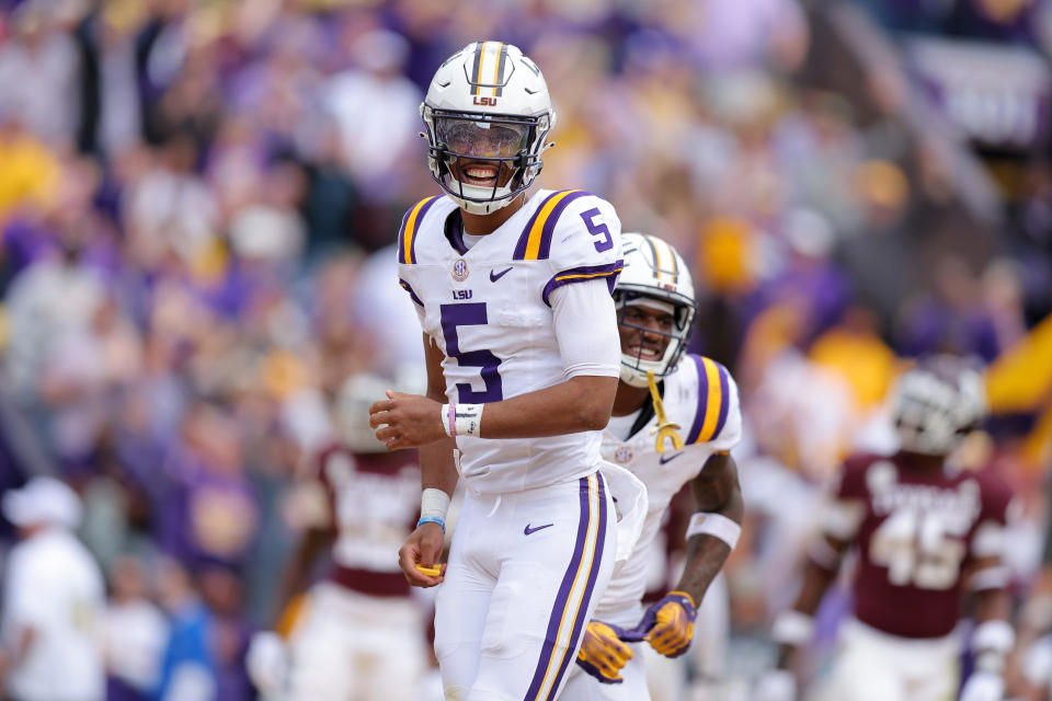 BATON ROUGE, LOUISIANA - NOVEMBER 25: Jayden Daniels #5 of the LSU Tigers celebrates a touchdown during a game against the Texas A&M Aggies at Tiger Stadium on November 25, 2023 in Baton Rouge, Louisiana. (Photo by Jonathan Bachman/Getty Images)