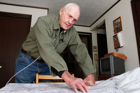 Bob Turri points to areas of the proposed national Bears Ears monument that he believes should remain open for energy development at his home in Monticello, Utah, U.S. December 19, 2016. Picture taken December 19, 2016. REUTERS/Annie Knox