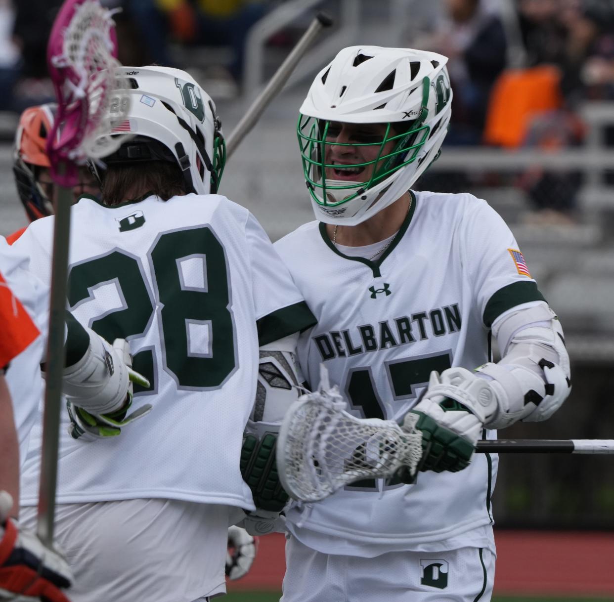 Morristown, NJ -- April 4, 2024 -- Willie Doyle celebrates a goal with Asher Testa of Delbarton as Delbarton edged Mt. Lakes 6-5 in their annual boys lacrosse rivalry game played at Delbarton.