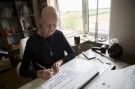 Sister Rachel Denton practices her calligraphy St Cuthbert's Hermitage in Lincolnshire, north east Britain August 24, 2015. REUTERS/Neil Hall