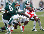 Carlos Hyde #34 of the Ohio State Buckeyes battles for yards during a fourth quarter run while playing the Michigan State Spartans at Spartan Stadium on September 29, 2012 in East Lansing, Michigan. Ohio State won the game 17-16. (Photo by Gregory Shamus/Getty Images)