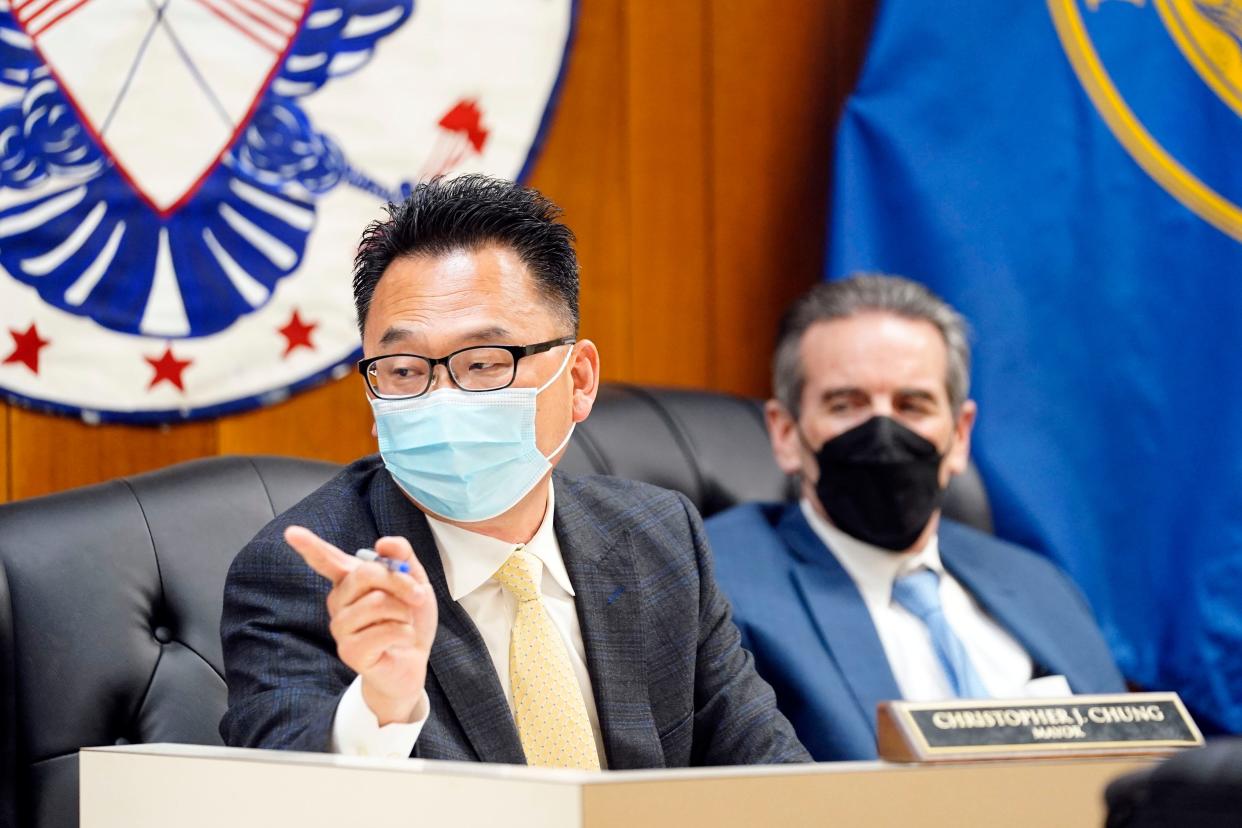 Palisades Park Mayor Christopher Chung speaks as borough attorney John Schettino looks on during a borough council meeting on Monday, May 23, 2022.