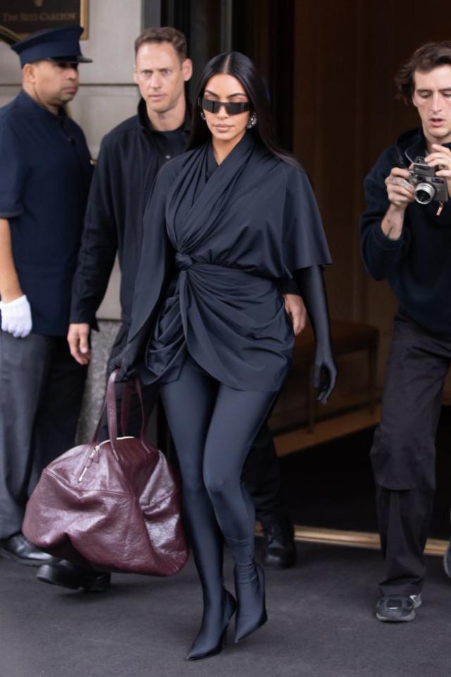 Kim Kardashian Brings Her New Signature Style to 'SNL' in a Latex Catsuit &  Knife Boots