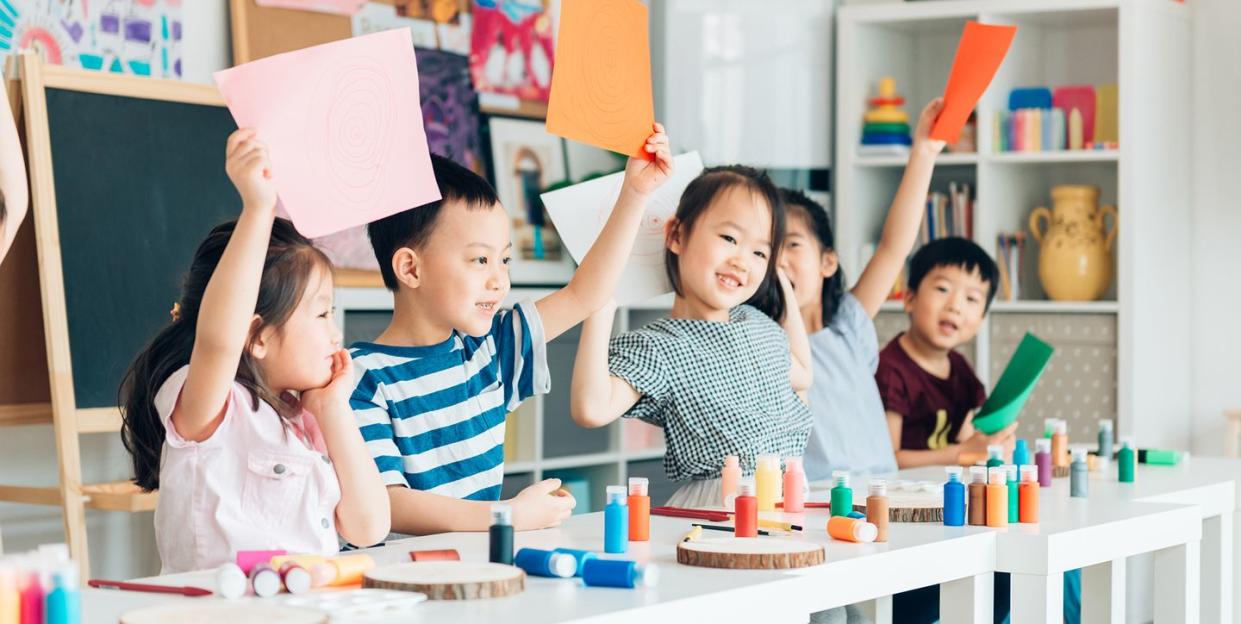 young kids in a colorful classroom