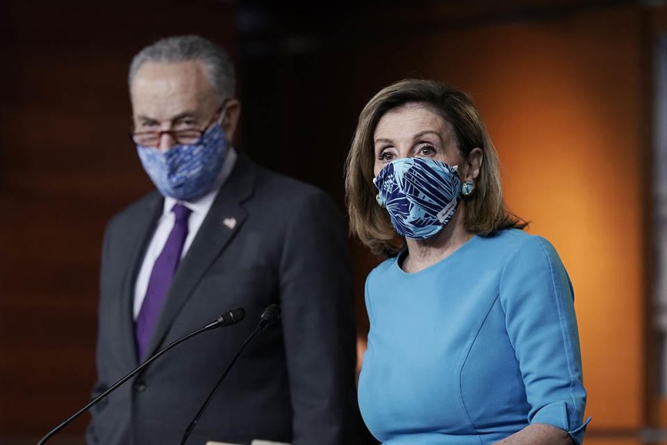 Speaker of the House Nancy Pelosi, D-Calif., and Senate Minority Leader Chuck Schumer, D-N.Y., meet with reporters on Capitol Hill in Washington, Thursday, Nov. 12, 2020. (AP Photo/J. Scott Applewhite)