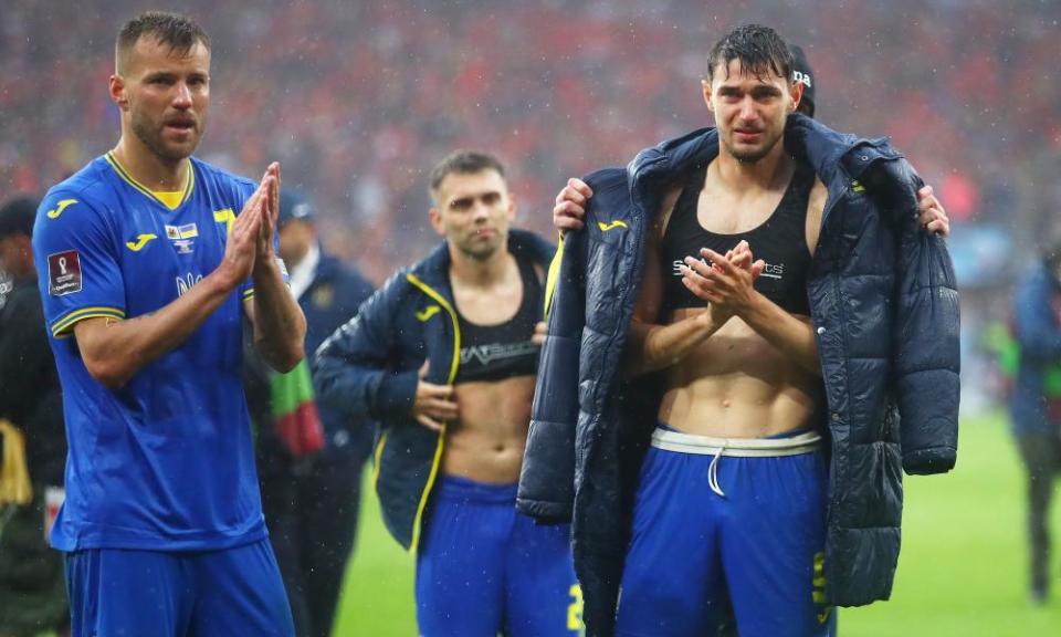 Andriy Yarmolenko and Roman Yaremchuk applaud their fans after their defeat