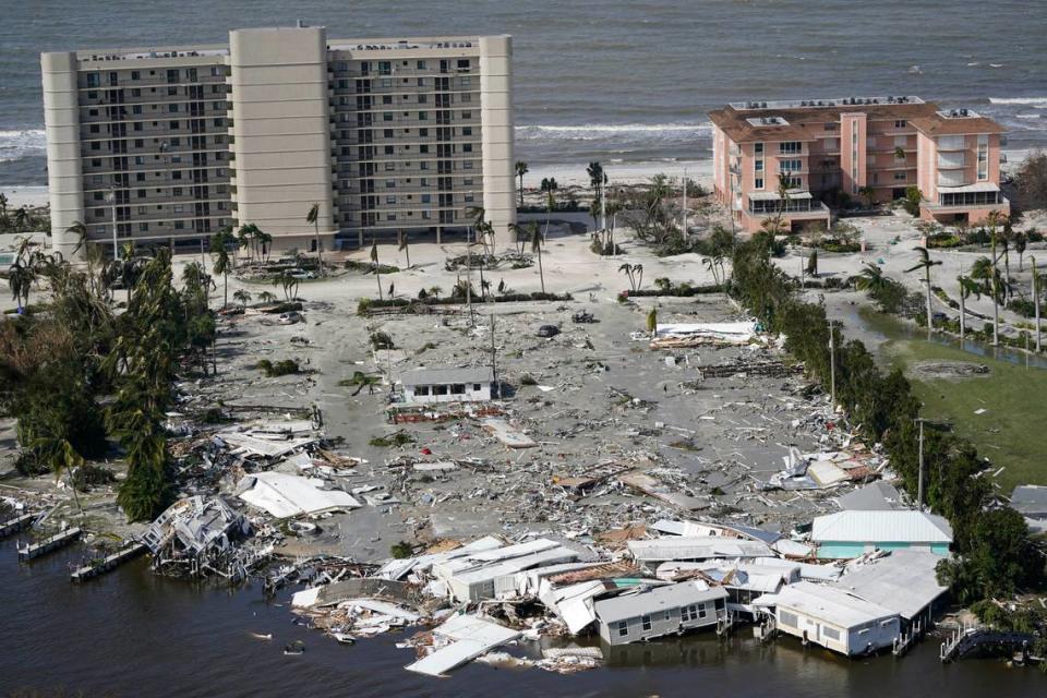 This aerial photo shows damaged homes and debris in the aftermath of Hurricane Ian, Thursday, Sept. 29, 2022, in Fort Myers, Fla.