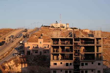 Israeli forces begin preparations to demolish homes near a military barrier on the outskirts of Jerusalem