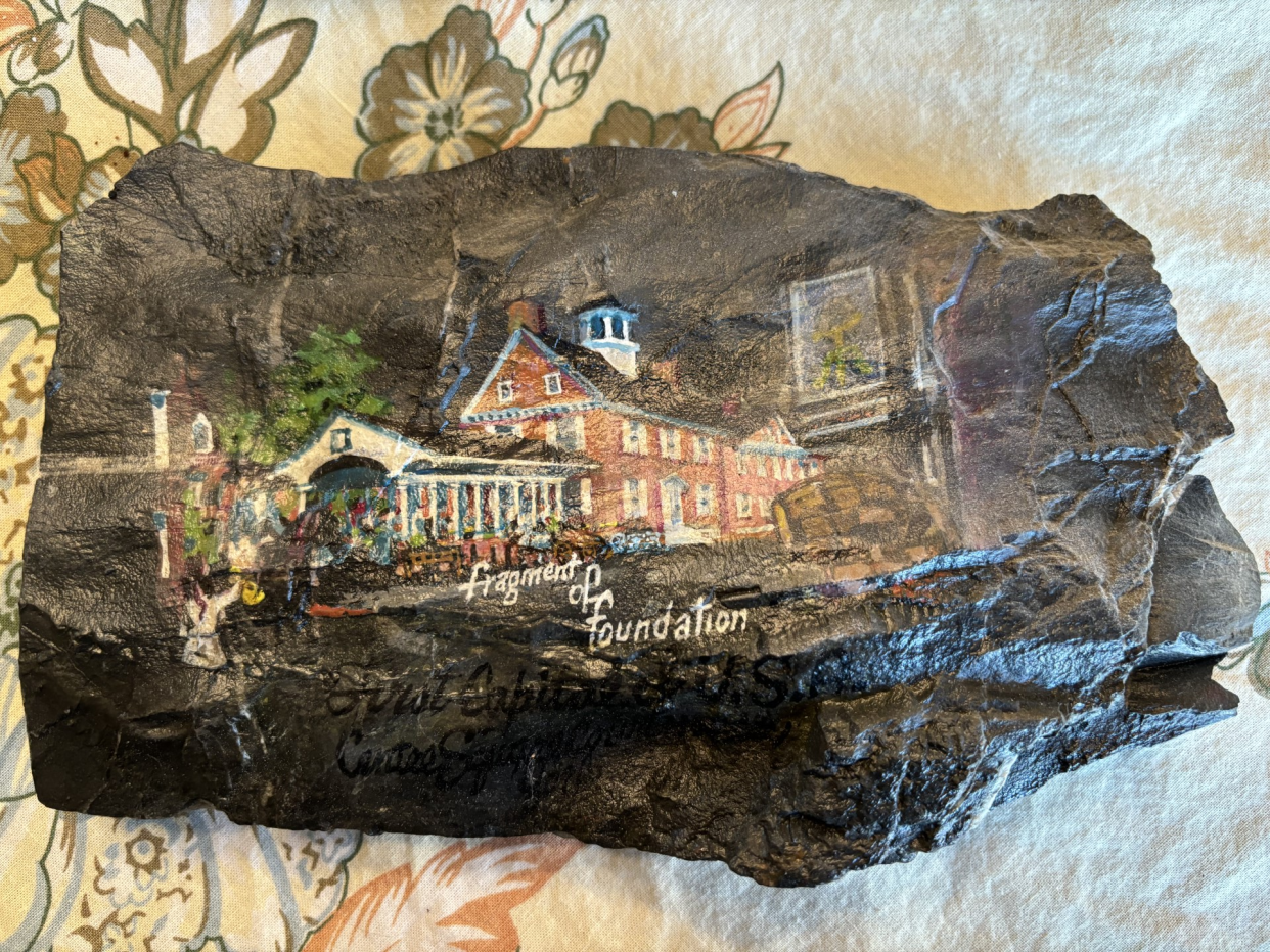 This frame bears a piece of the limestone foundation of the original York County Courthouse. Photographer Bill Schintz retrieved this rock in an excavation of Continental Square in 1975 and later exhibited it near the entry inside his East Market Street home.