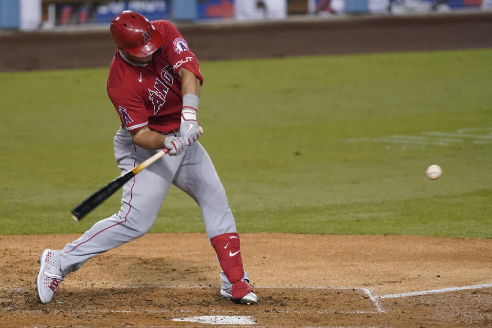 Los Angeles Angels' Mike Trout hits a home run during the third inning of the team's baseball game against the Los Angeles Dodgers on Friday, Sept. 25, 2020, in Los Angeles. (AP Photo/Ashley Landis)