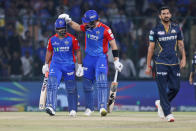 Delhi Capitals' captain Rishabh Pant, left, is congratulated by teammate Tristan Stubbs for his big hitting in the last over of Gujarat Titans' Mohit Sharma, right, during the Indian Premier League cricket match between Delhi Capitals and Gujarat Titans in New Delhi, India, Wednesday, April 24, 2024. (AP Photo/Pankaj Nangia)