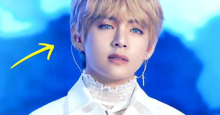 V looks like an angel as he sports blue contact lens and cross earring