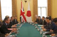 Britain's Prime Minister David Cameron, left, speaks to Japan's Prime Minister Shinzo Abe as they meet at 10 Downing Street in London, Britain Thursday, May 5, 2016. REUTERS/Frank Augstein/pool