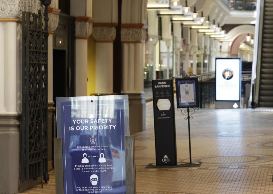 A normally busy shopping area in Sydney is empty of people, Wednesday, July 7, 2021. Sydney's two-week lockdown has been extended for another week due to the vulnerability of an Australia population largely unvaccinated against COVID-19, officials said. (AP Photo/Rick Rycroft)