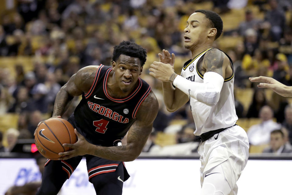 Georgia's Tyree Crump (4) heads to the basket as Missouri's Xavier Pinson defends during the first half of an NCAA college basketball game Tuesday, Jan. 28, 2020, in Columbia, Mo. (AP Photo/Jeff Roberson)