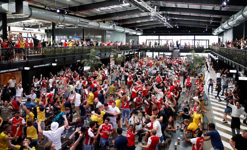 Arsenal fans watch the FA Cup Final between Arsenal and Chelsea