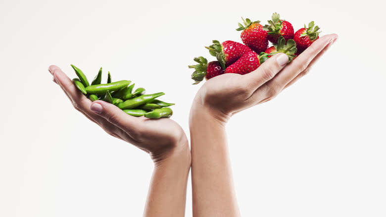 hands with fruit and vegetables