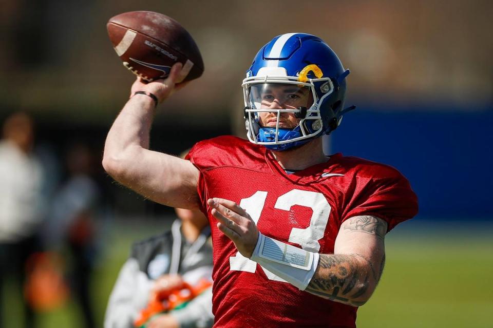 Kentucky quarterback Devin Leary throws a pass at the team’s open practice on Saturday.