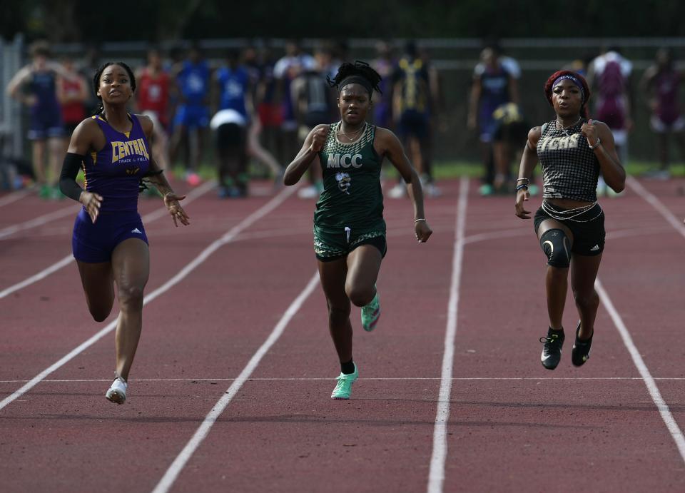 La'Neal Wilder (from left), of Fort Pierce Central, Jahkya Miller, of Melbourne Central Catholic, and Kalani Benjamin, of Treasure Coast, compete in heat 4 of the girls 100 meter race during the 27th annual Bill Wilson Invitational track meet at Sebastian River High School track on Saturday, March 9, 2024, in Sebastian. Wilder finished first with a time of 12.47, Miller finished 4th with a time of 12.86, and Benjamin finished 5th with a time of 12.87.