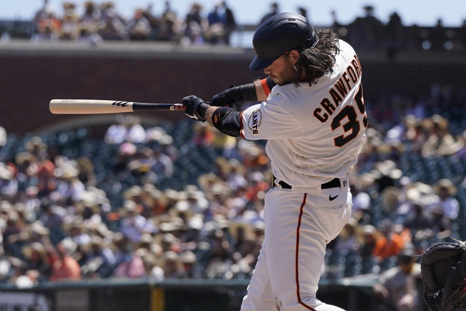 San Francisco Giants' Brandon Crawford hits a three-run home run against the San Diego Padres during the second inning of a baseball game in San Francisco, Saturday, May 8, 2021. (AP Photo/Jeff Chiu)