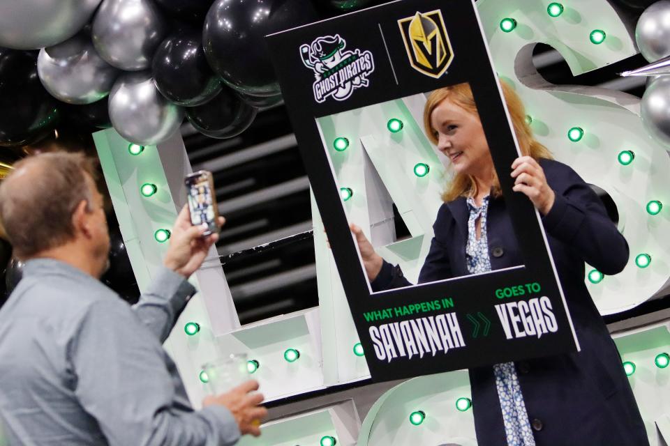 Natalie McKee gets her photo taken with a prop with both the Ghost Pirates and the Vegas Golden Knights logos on it during the event to announce the Ghost Pirates' first head coach and NHL team affiliation at Enmarket Arena on Thursday. Rick Bennett was announced as head coach and the Vegas Golden Knights were announced as the NHL team affiliation.