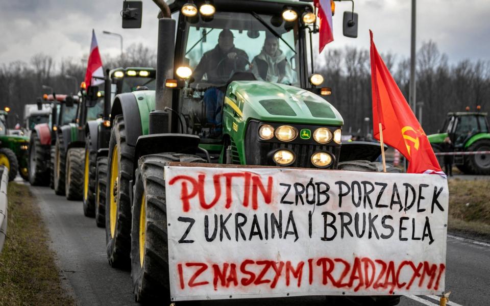 The banner on a Polish farmer's tractor reads "Putin - sort out Ukraine, Brussels and our government."