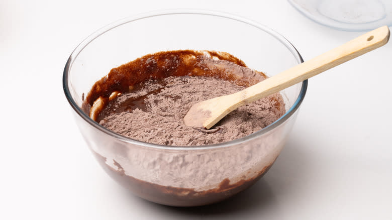 mixing brownie batter in bowl