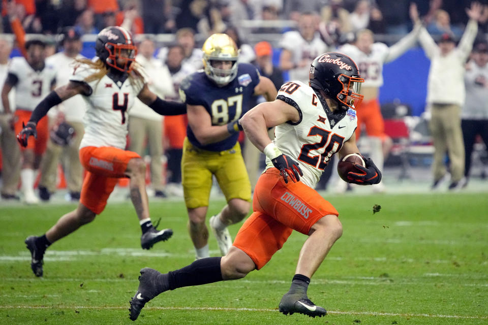 Oklahoma State linebacker Malcolm Rodriguez (20) intercepts a pass against Notre Dame during the second half of the Fiesta Bowl NCAA college football game, Saturday, Jan. 1, 2022, in Glendale, Ariz. (AP Photo/Rick Scuteri)