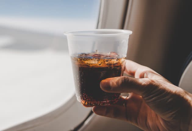 That soda is only going to add more gas to your digestive system. (Photo: AerialPerspective Images via Getty Images)