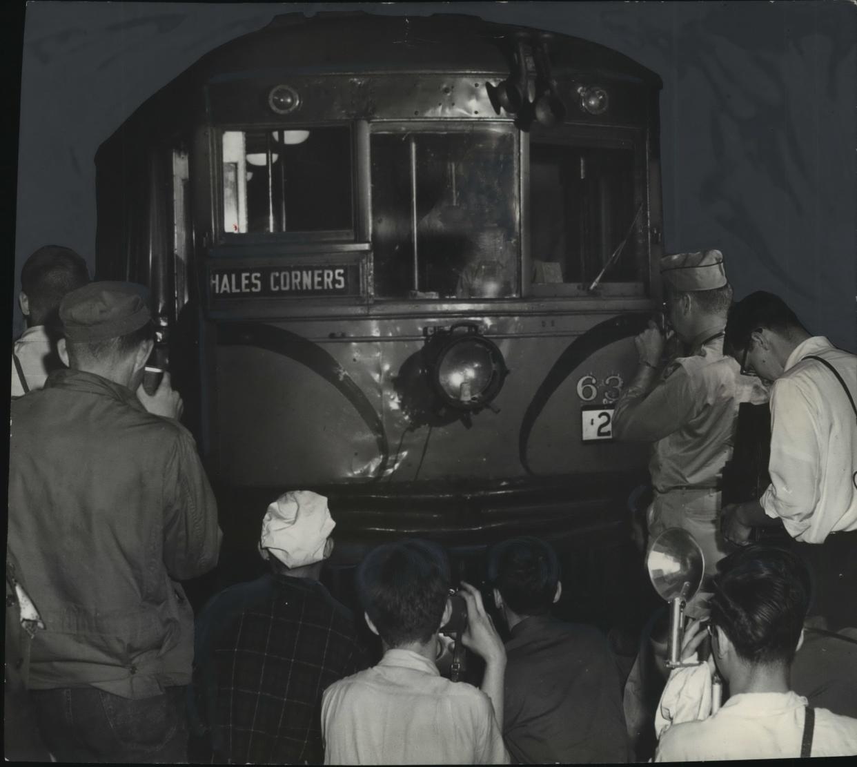Railroad fans crowd to take pictures of the Milwaukee Rapid Transit & Speedrail line train car at the downtown Milwaukee terminal before it makes its final run to Hales Corners on June 30, 1951.
