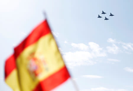 Four Eurofighter jets take part in a flypast as part of celebrations to mark Spain's National Day in Madrid, Spain October 12, 2017. REUTERS/Andrew Winning