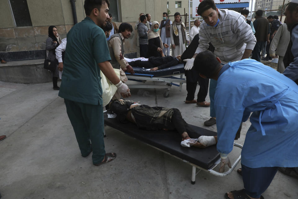 Injured school students are transported to a hospital after a bomb explosion near a school in west of Kabul, Afghanistan, Saturday, May 8, 2021. A bomb exploded near a school in west Kabul on Saturday, killing several people, many them young students, an Afghan government spokesmen said. (AP Photo/Rahmat Gul)