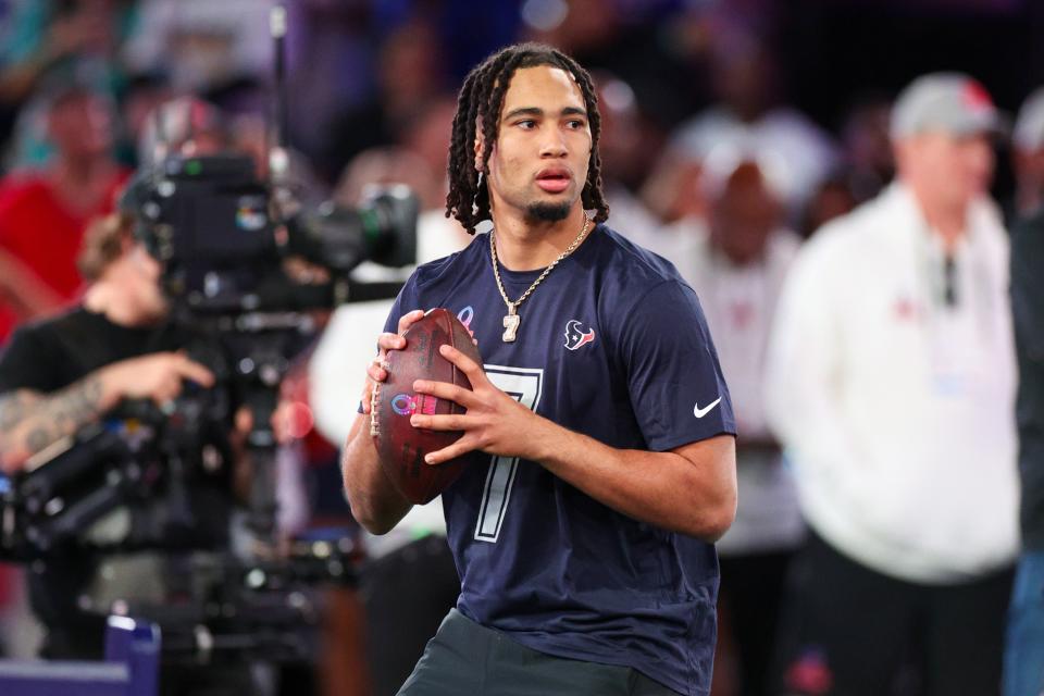 Feb 1, 2024; Orlando, FL, USA; Houston Texans quarterback C.J. Stroud (7) participates in the NFL Pro Bowl Skills Competition at the UCF NIcholson Fieldhouse. Mandatory Credit: Nathan Ray Seebeck-USA TODAY Sports