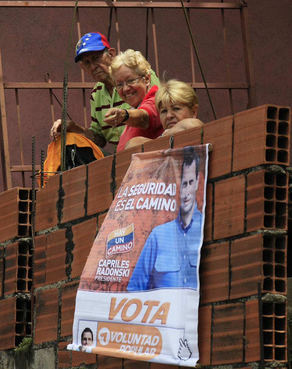 Supporters of opposition presidential candidate Henrique Capriles cheer during a campaign rally in Caracas, Venezuela, Sunday, Sept. 16, 2012. Capriles is running against President Hugo Chavez in the country's Oct. 7 election. (AP Photo/Fernando Llano)