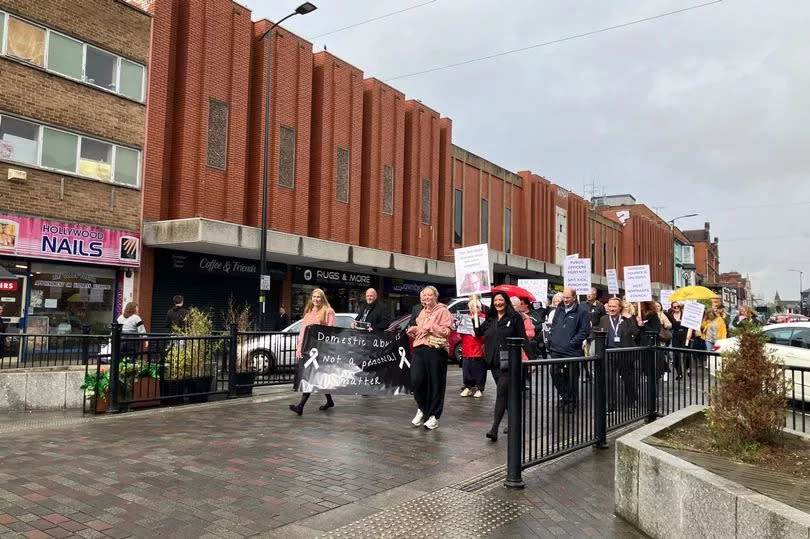 A large group of protestors marched down Abington Street to the council chambers.