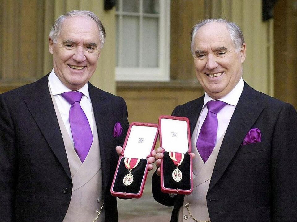 British businessmen, Sir Frederick Barclay (left) and his twin brother, Sir David Barclay, outside Buckingham Palace after receiving their Knighthoods in 2000.