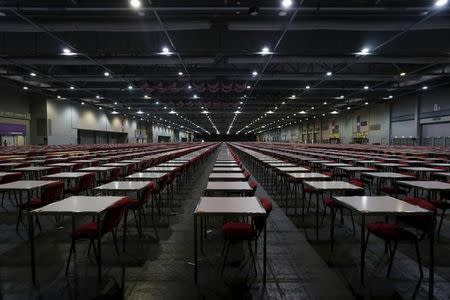 Thousands of tables are seen inside a hall at Asia-World Expo near Hong Kong Airport in Hong Kong, China October 2, 2015, one day before SAT examinations to be taken place. REUTERS/Bobby Yip