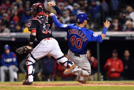 Oct 26, 2016; Cleveland, OH, USA; Chicago Cubs catcher Willson Contreras (40) is forced out at home by Cleveland Indians catcher Roberto Perez (55) in the 7th inning in game two of the 2016 World Series at Progressive Field. Mandatory Credit: Ken Blaze-USA TODAY Sports