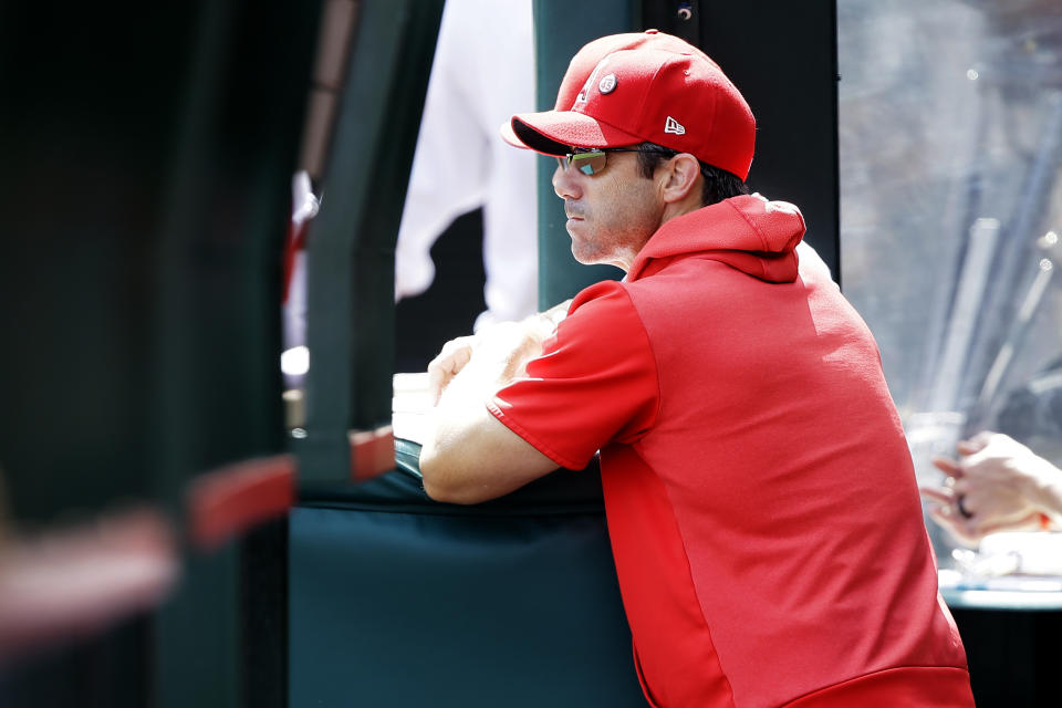 Los Angeles Angels manager Brad Ausmus looks out at the field during the first inning of a baseball game against the Houston Astros in Anaheim, Calif., Sunday, Sept. 29, 2019. (AP Photo/Alex Gallardo)