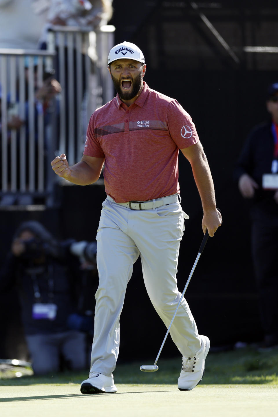 Jon Rahm reacts after a birdie putt on the 14th hole during the final round of the Genesis Invitational golf tournament at Riviera Country Club, Sunday, Feb. 19, 2023, in the Pacific Palisades area of Los Angeles. (AP Photo/Ryan Kang)