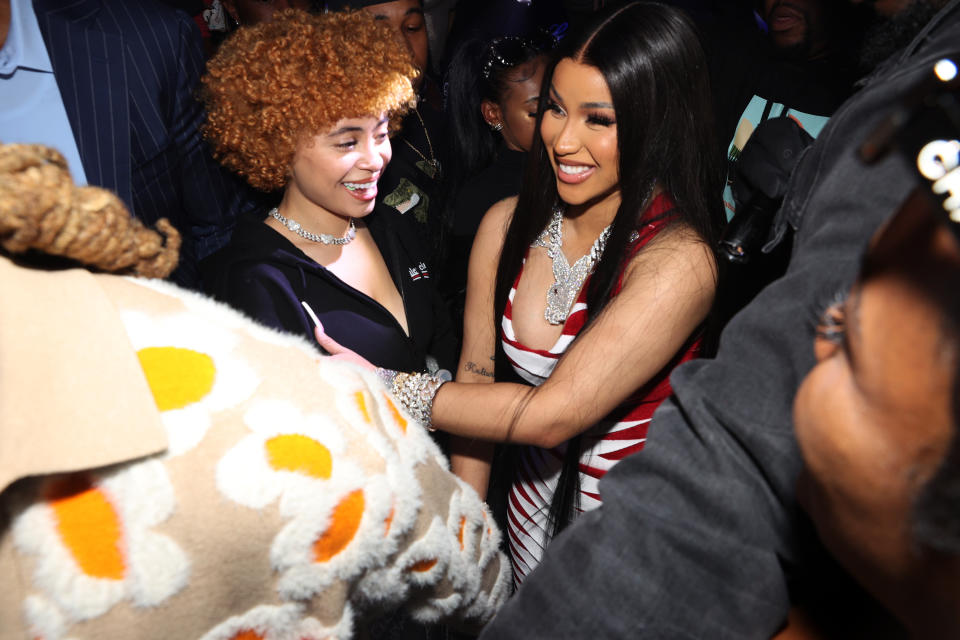 Ice Spice and Cardi B in a group of people