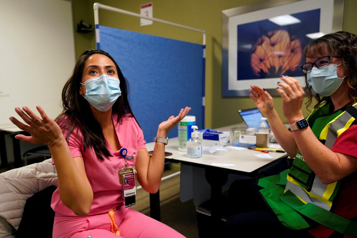 Physician Luisa Vera reacts after receiving the Pfizer-BioNTech coronavirus disease (COVID-19) vaccine at Indiana University Health, Methodist Hospital in Indianapolis, Indiana, U.S., December 16, 2020. REUTERS/Bryan Woolston     TPX IMAGES OF THE DAY