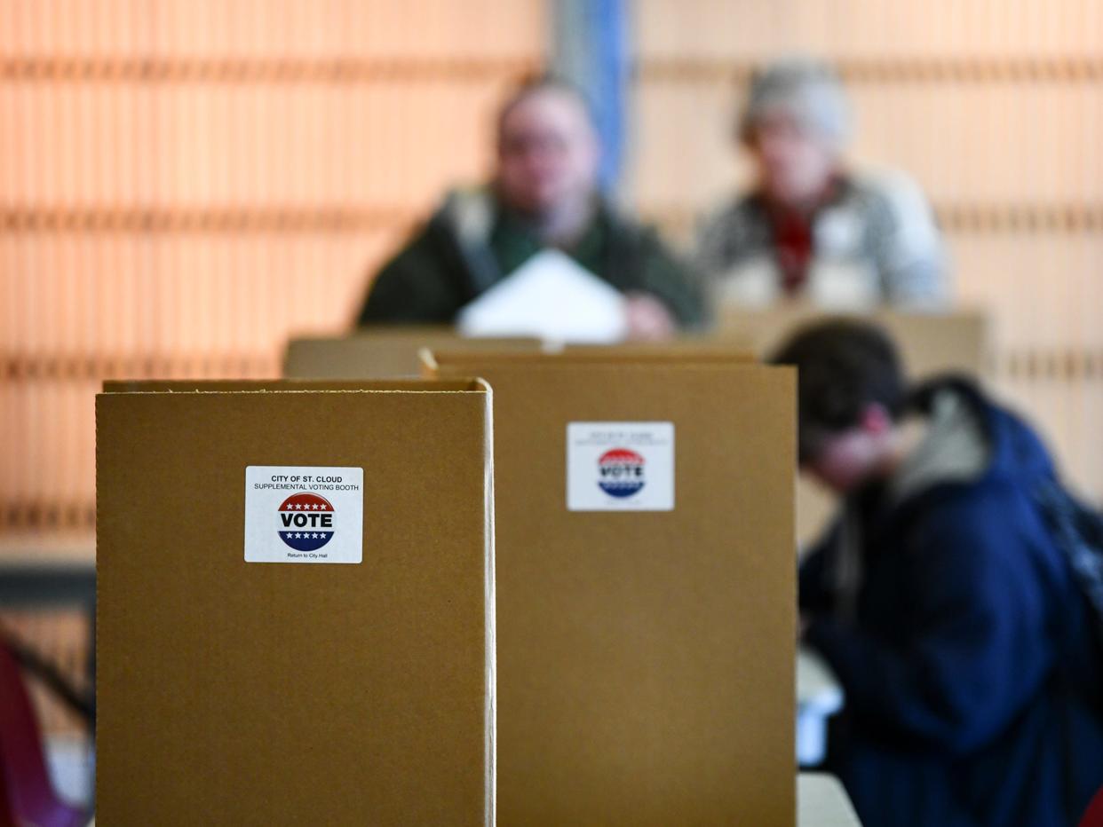 Voters fill out their ballots during the Minnesota presidential primary election Tuesday, March 3, 2020, at the St. Cloud Public Library.