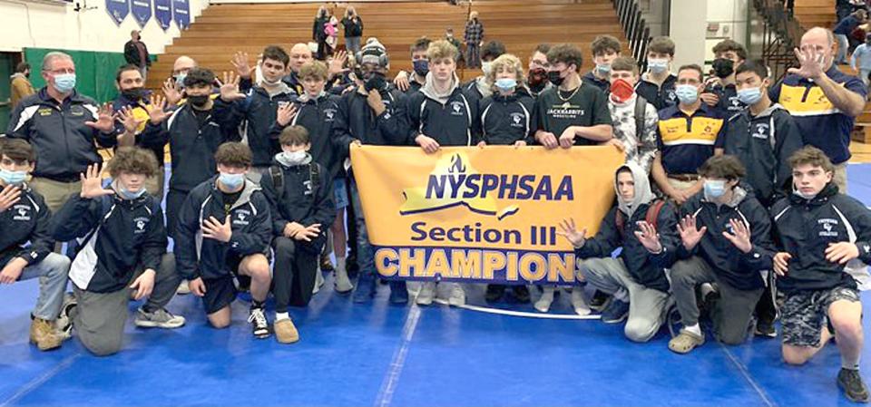 The Central Valley Academy wrestling team poses with its banner after winning its fifth consecutive Division II dual meet tournament championship Jan. 20 at Cicero-North Syracuse High School. The Thunder won the section's Class B tournament for the sixth consecutive time and had four individual champions crowned Saturday in Homer.